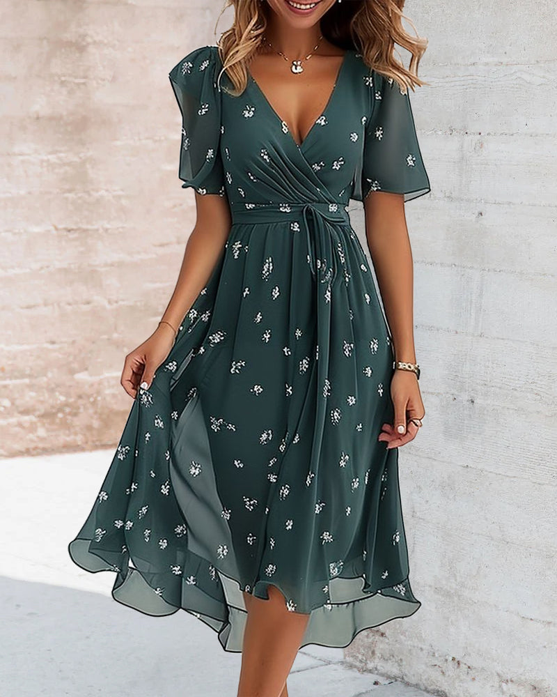 Elegante jurk met gestrikte V-hals en print