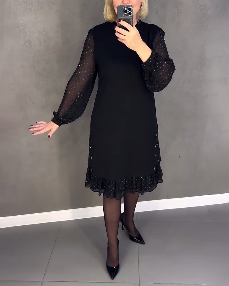 Elegante jurk met lange mouwen en stippen
