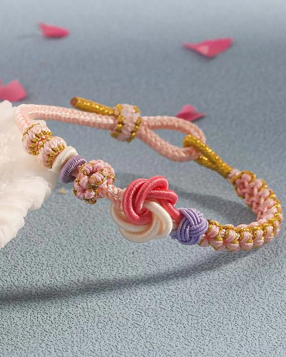 Armband met knoop van perzikbloesems