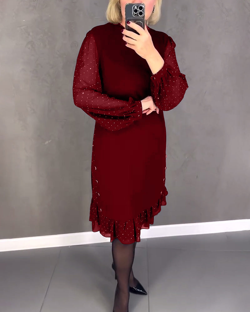 Elegante jurk met lange mouwen en stippen