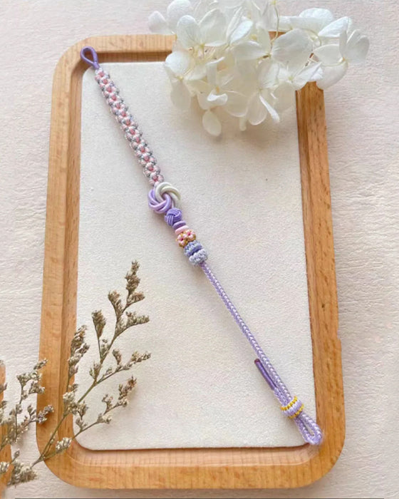 Armband met knoop van perzikbloesems