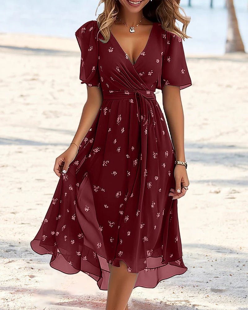 Elegante jurk met gestrikte V-hals en print