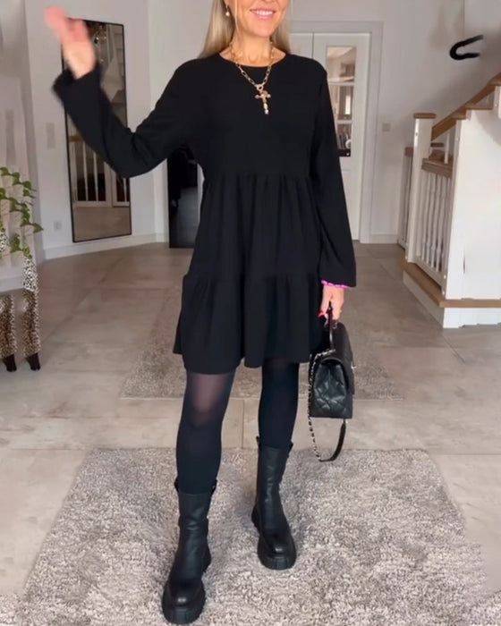 Eenvoudige effen jurk met lange mouwen