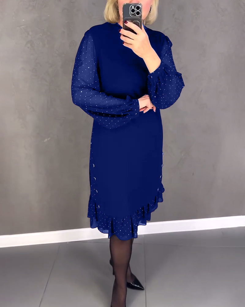 Elegante jurk met lange mouwen en stippen