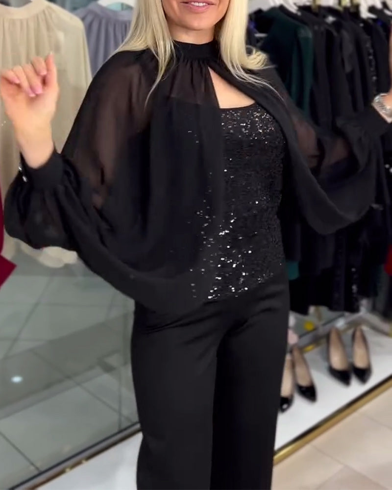 Blouse statement vleermuismouw pailletten