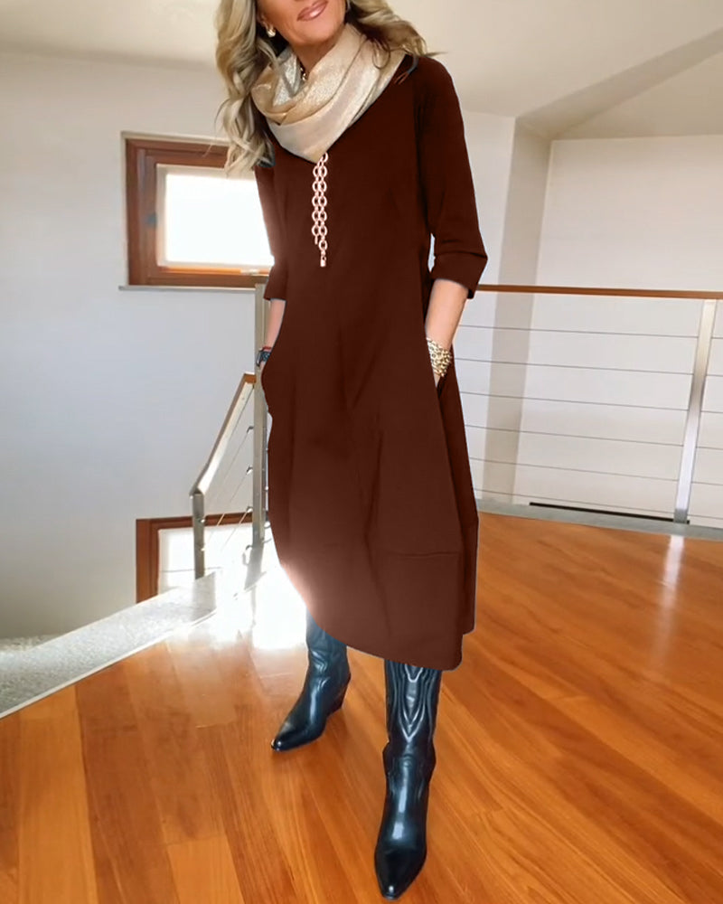 Elegante effen jurk met ronde hals en zak