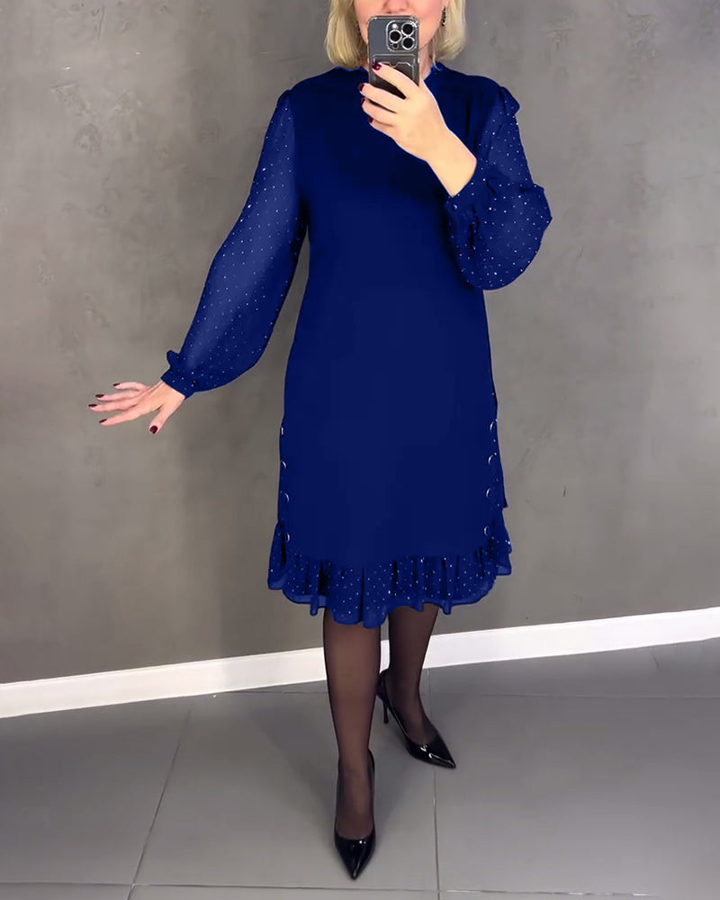 Elegante jurk met lange mouwen en stippen