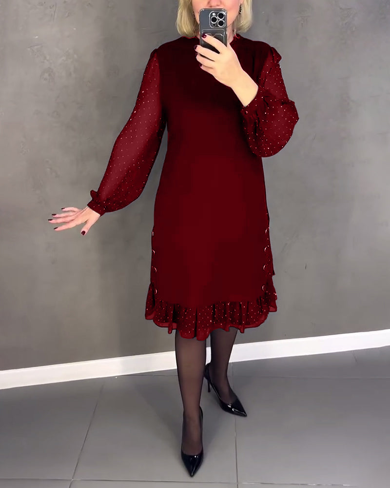 Elegante jurk met lange mouwen en stippen
