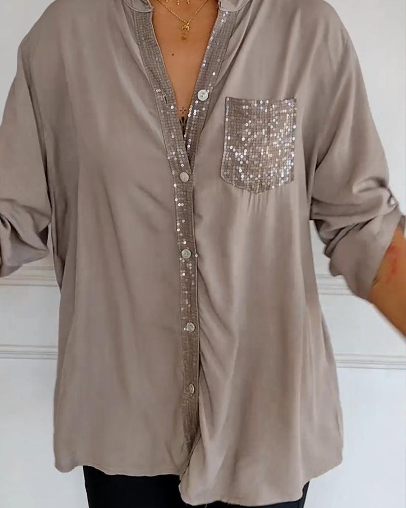 Casual top met knopen en pailletten
