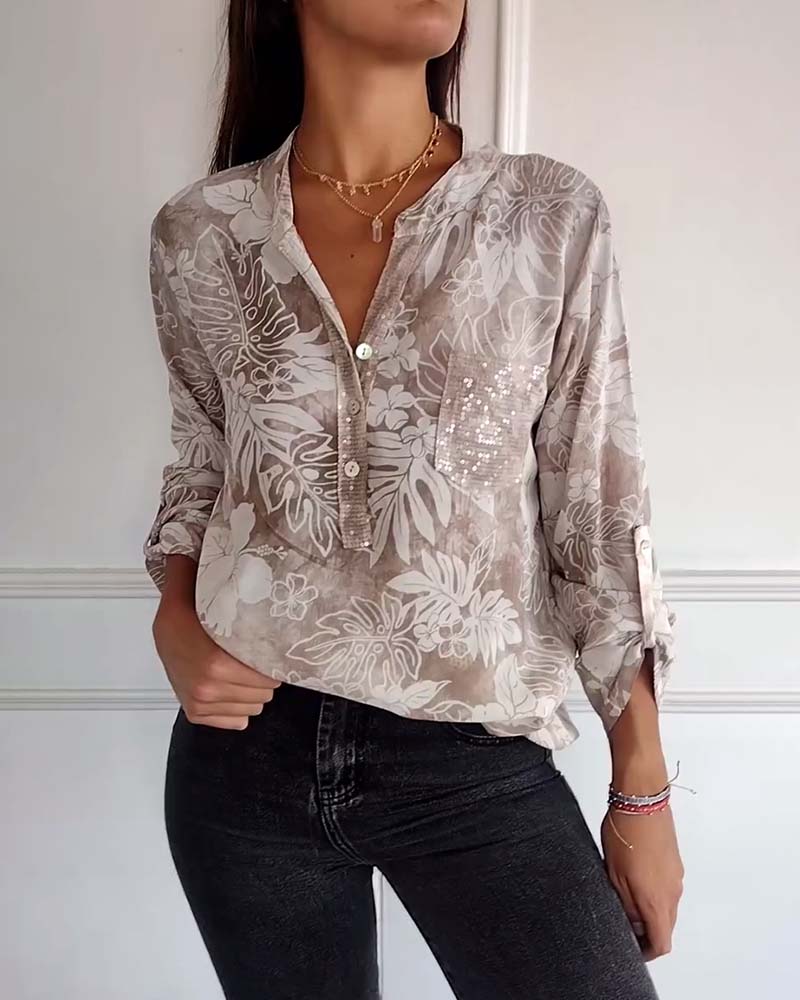 Top met bladprint en patchwork-pailletten