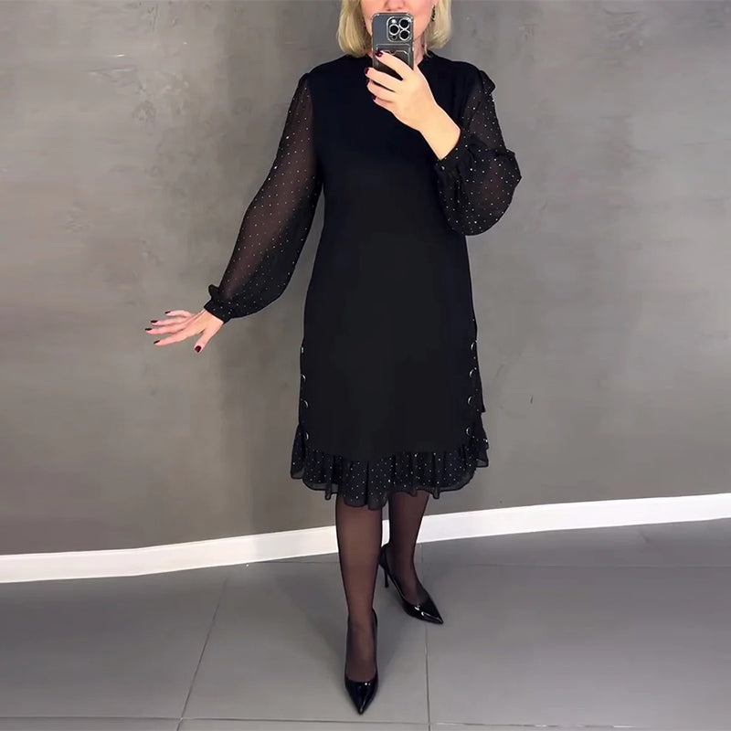 Elegante jurk met lange mouwen en stippen
