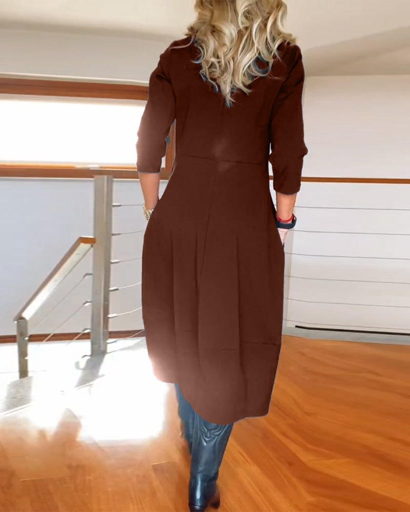 Elegante effen jurk met ronde hals en zak