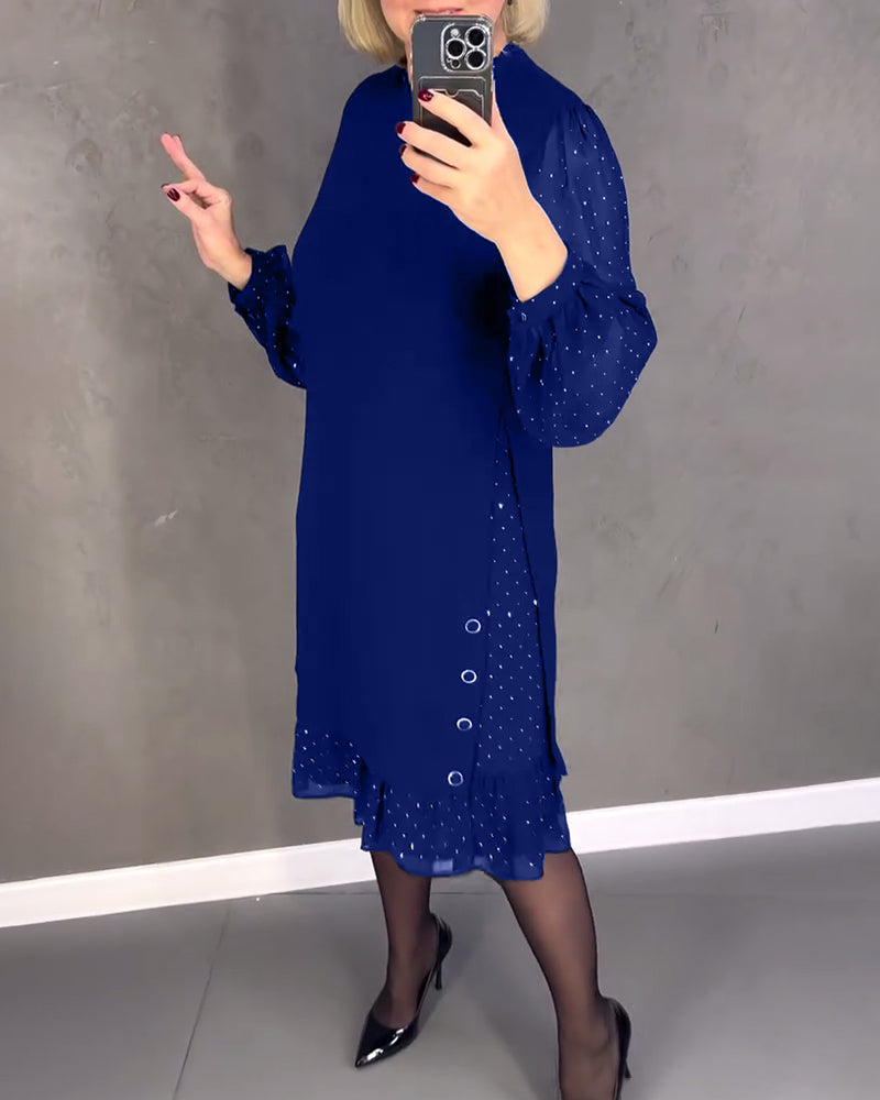 Elegante jurk met lange mouwen en stippen