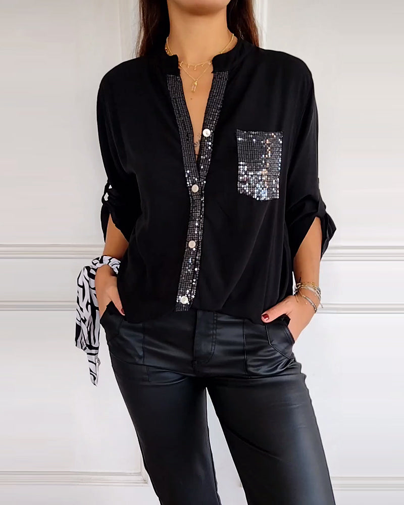 Casual top met knopen en pailletten