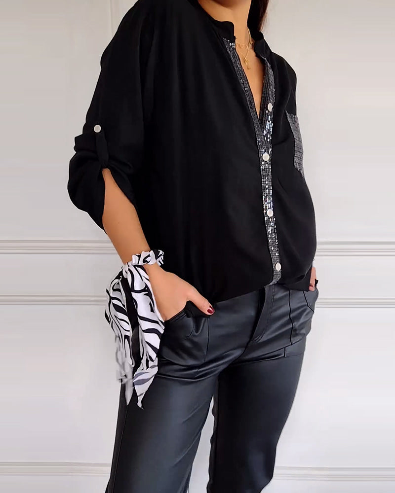 Casual top met knopen en pailletten