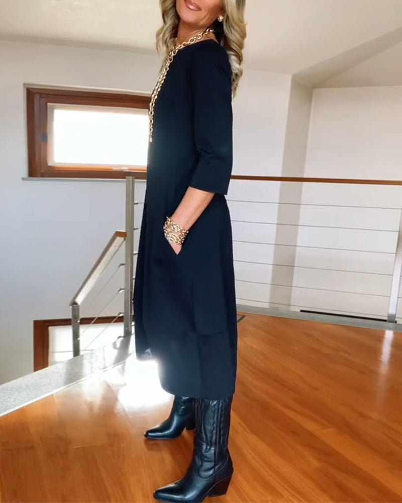 Elegante effen jurk met ronde hals en zak