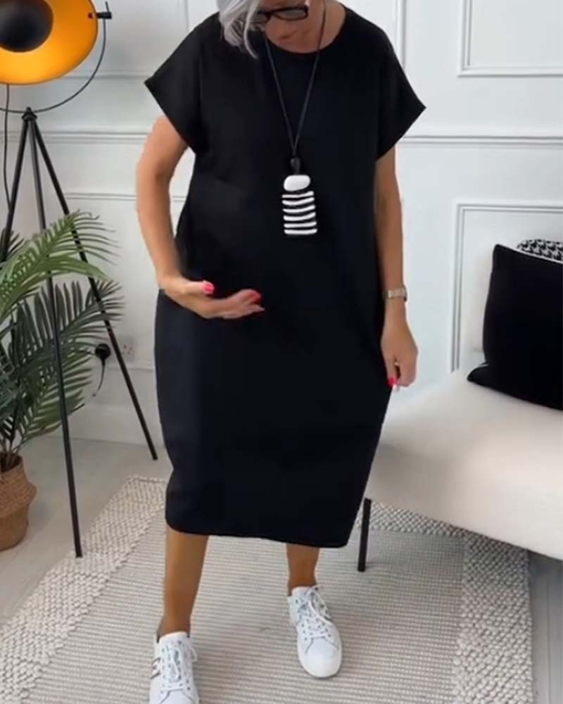 Eenvoudige casual jurk met korte mouwen en letterprint
