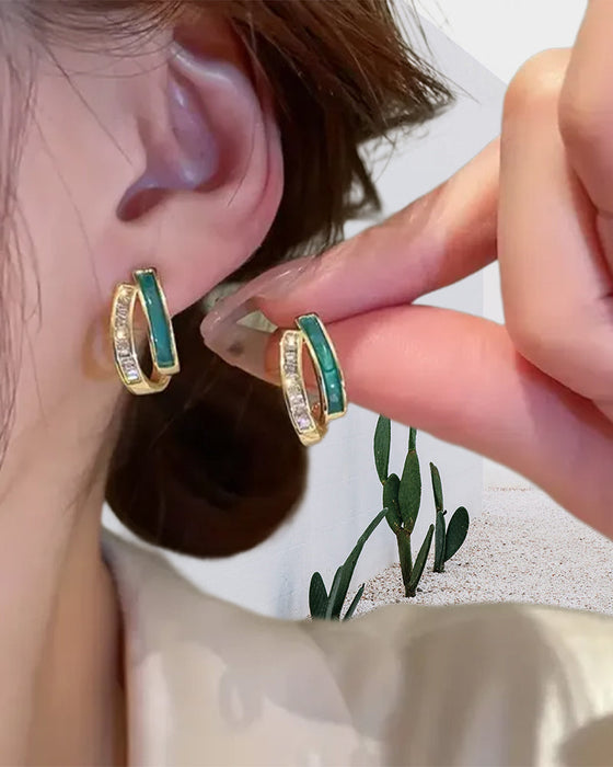 Modieuze dubbele smaragdgroene oorbellen