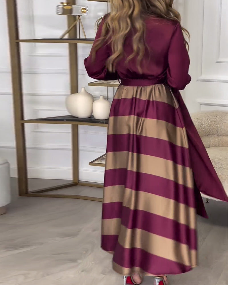 Elegante gestreepte bedrukte jurk met revers en band
