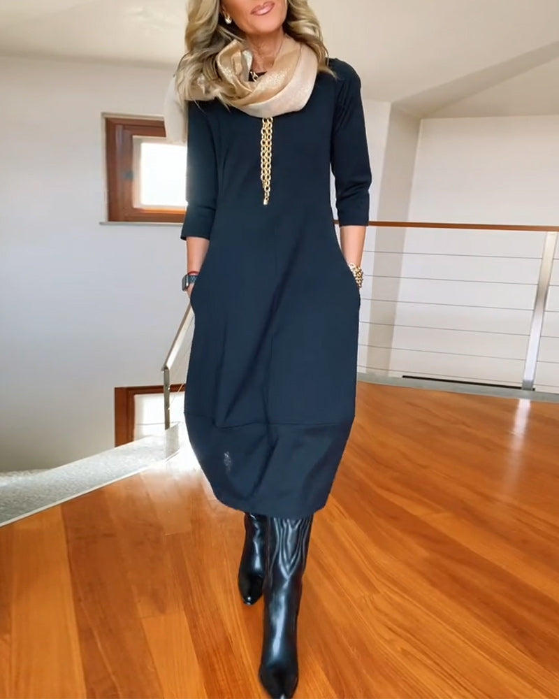 Elegante effen jurk met ronde hals en zak