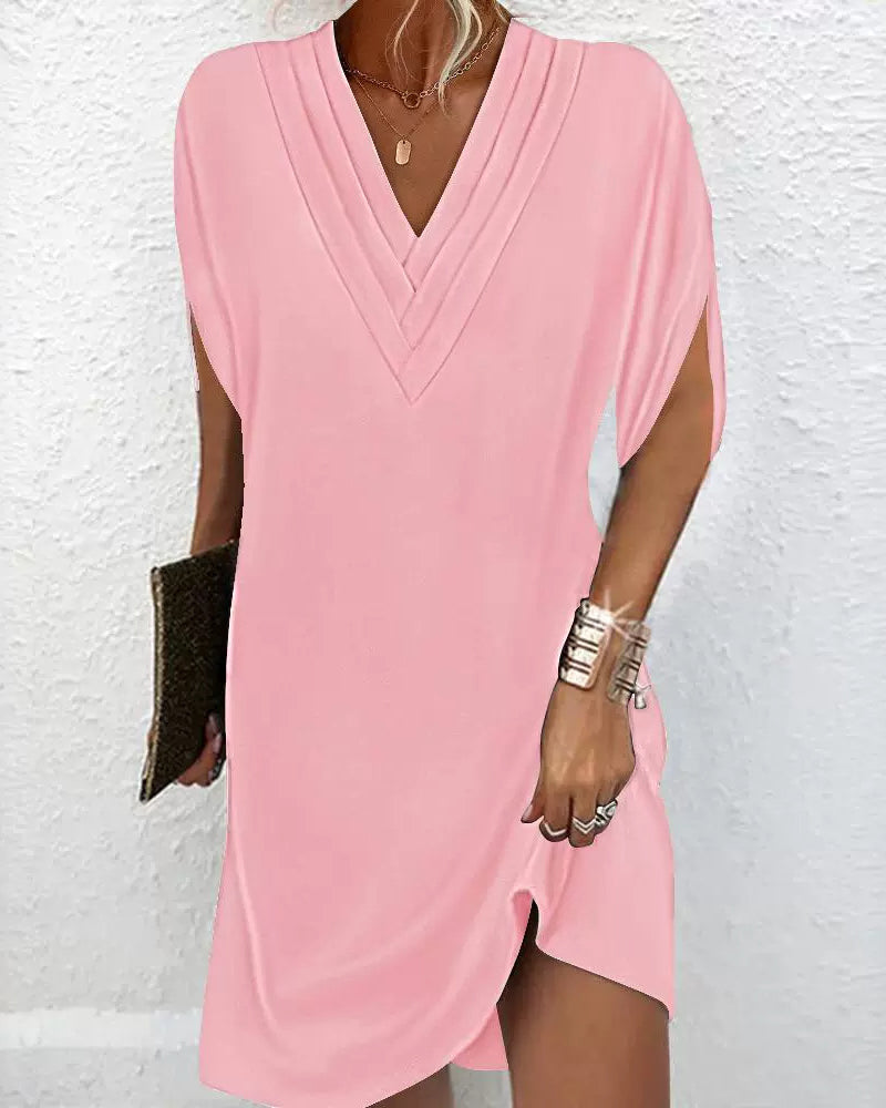Elegante jurk met splitmouwen in effen kleur