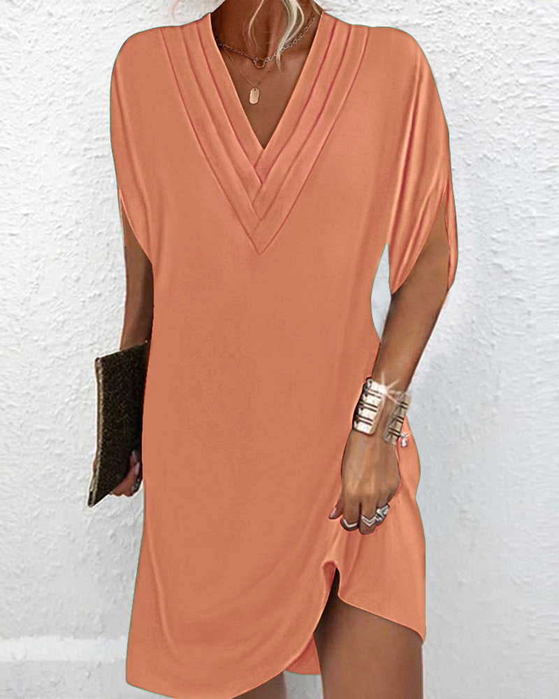 Elegante jurk met splitmouwen in effen kleur