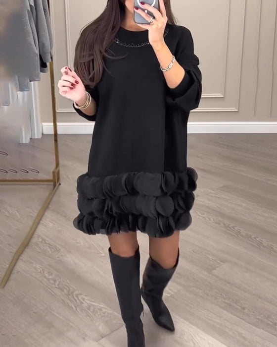 Elegante jurk met patchwork bloemblaadjes