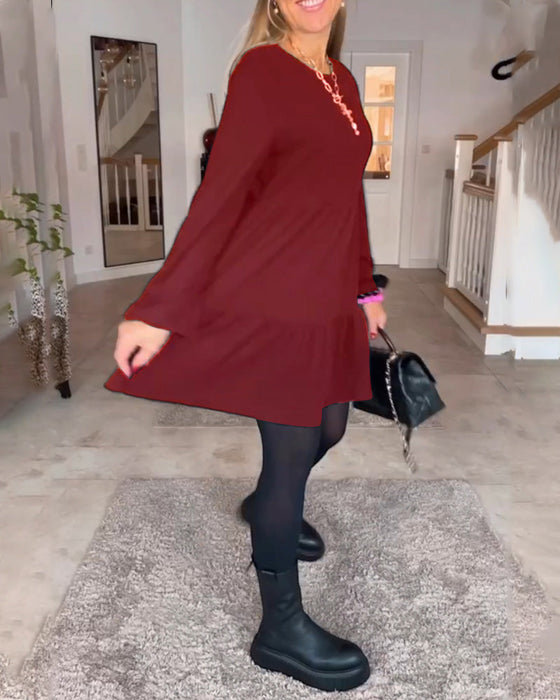 Eenvoudige effen jurk met lange mouwen