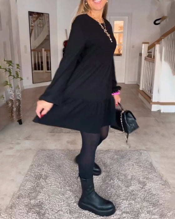 Eenvoudige effen jurk met lange mouwen