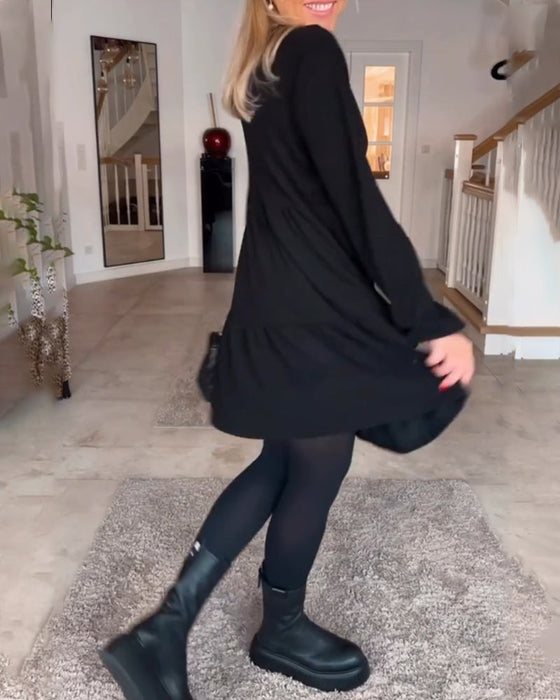 Eenvoudige effen jurk met lange mouwen