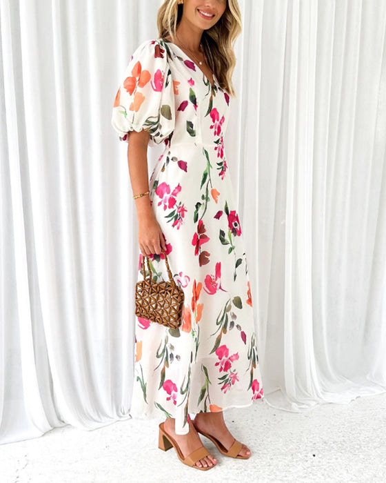 Elegante jurk met pofmouwen en bloemenprint