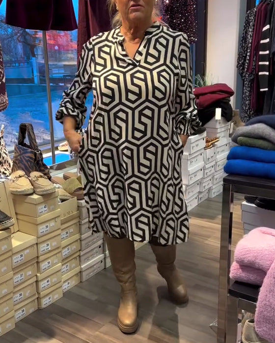 Stijlvolle jurk met V-hals en geometrisch patroon