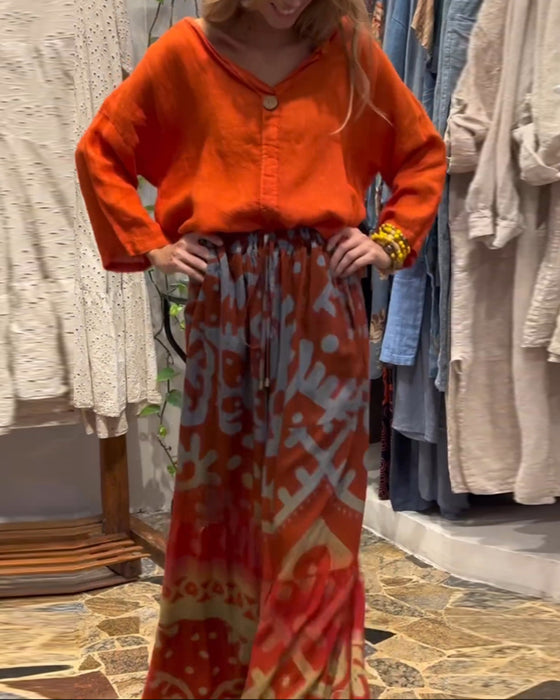 Losse broek met wijde pijpen en zak met print