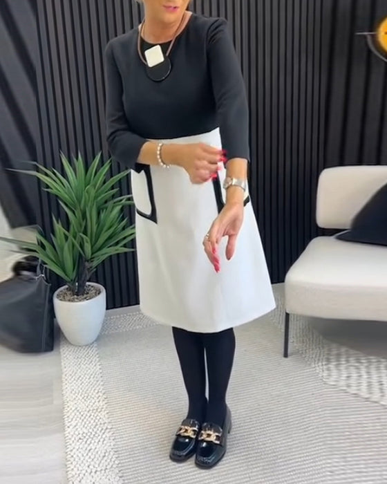 Casual contrasterende jurk met ronde hals en zak