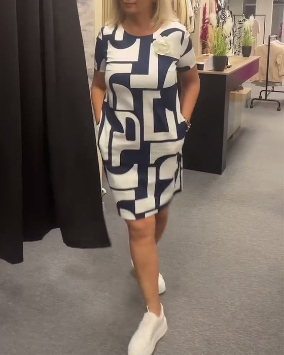 Jurk met ronde hals en zak met geometrische print