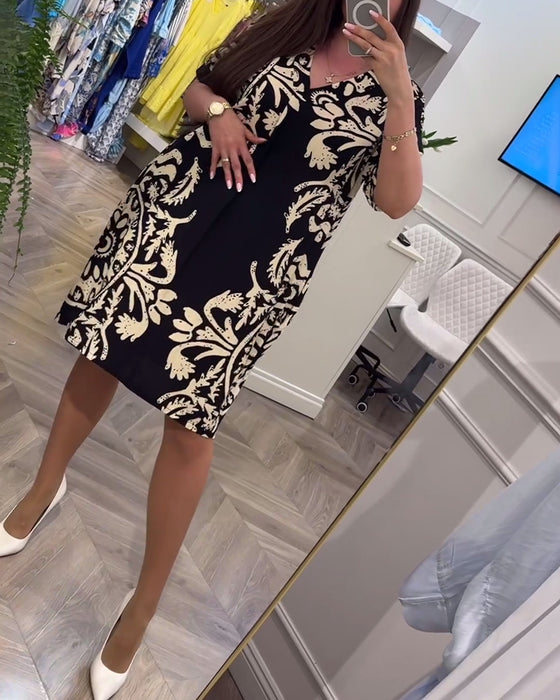 Losse jurk met korte mouwen en retroprint met V-hals en korte mouwen