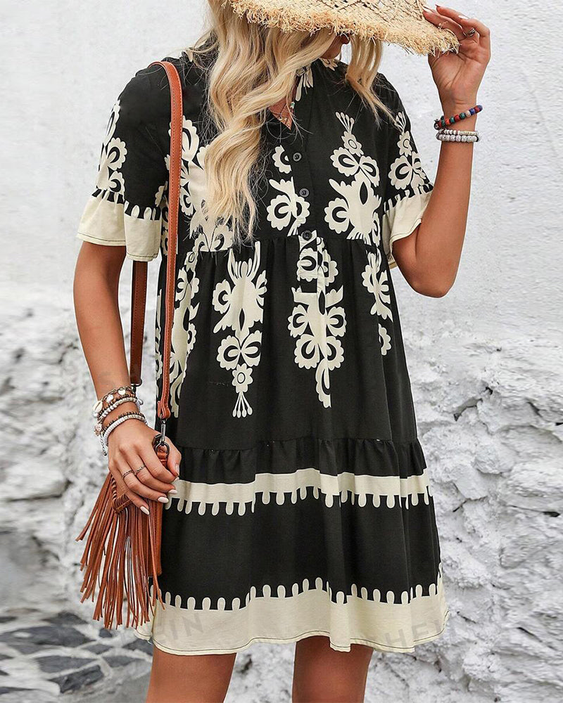 Elegante jurk met knopen en korte mouwen met print