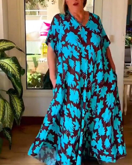 Losse jurk met V-hals en zak met bloemenprint