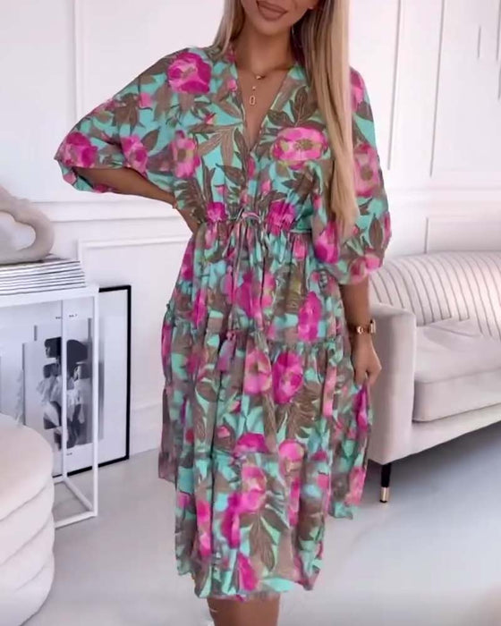 Elegante jurk met trekkoorden en bloemenprint