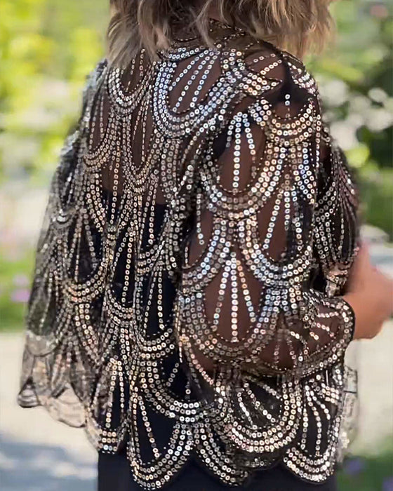 Elegante jas met lovertjes en golvende rand