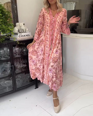 Elegante jurk met V-hals, knoopsluiting en trekkoord met print