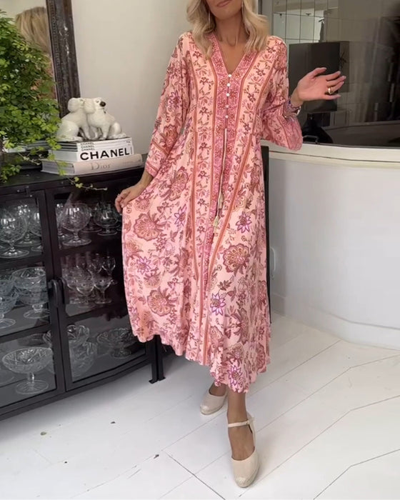 Elegante jurk met V-hals, knoopsluiting en trekkoord met print