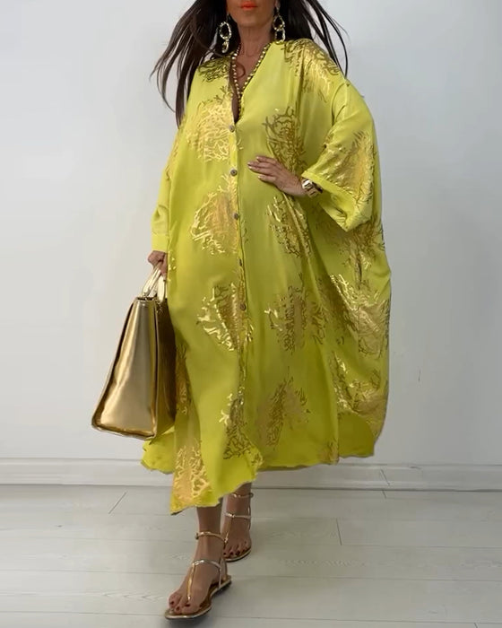 Losse jurk met lange mouwen en knoopsluiting