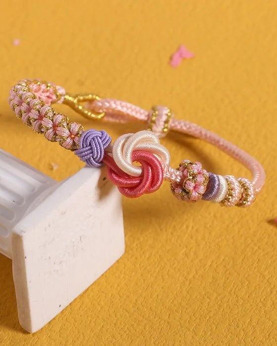 Armband met knoop van perzikbloesems