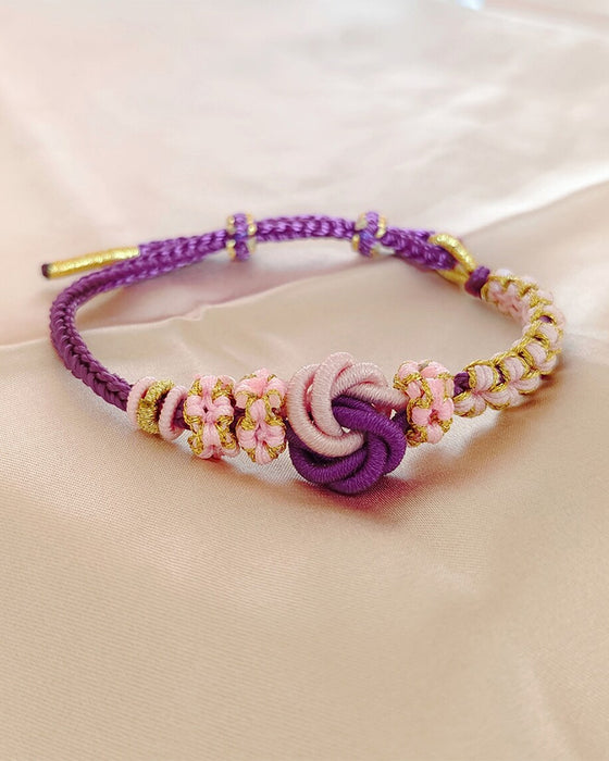 Armband met knoop van perzikbloesems
