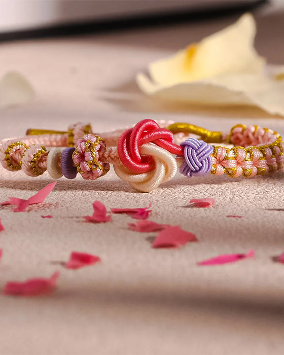 Armband met knoop van perzikbloesems