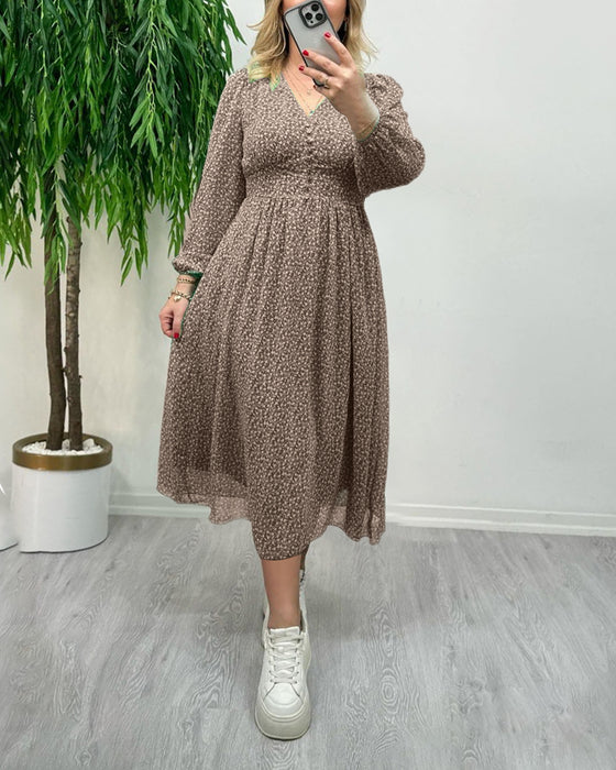 Elegante jurk met knopen en print