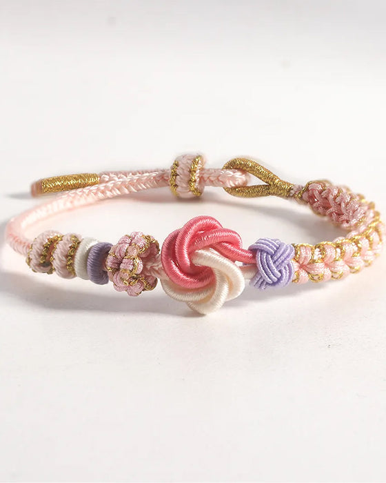 Armband met knoop van perzikbloesems