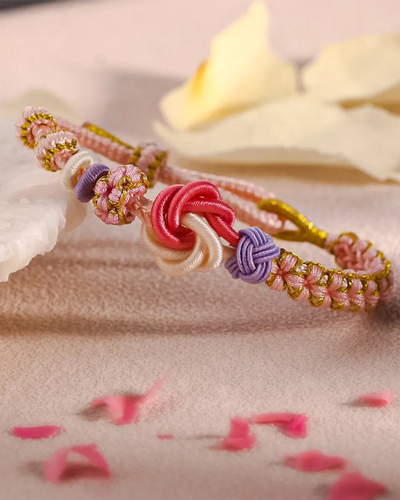 Armband met knoop van perzikbloesems