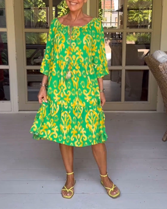 Jurk met losse print en klokmouwen